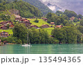 Hillside houses above Lake Brienz in Iseltwald Switzerland 135494365