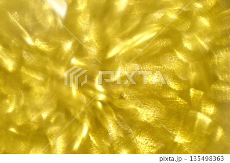 Abstract yellow light patterns creating bright and vibrant textured background Abstract yellow light patterns creating bright and vibrant textured background 135498363