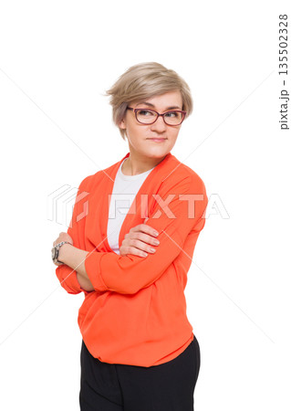 Blond stylish shy woman in eyeglasses. Young fashionable businesswoman in casual clothes. Beautiful attractive female portrait isolated at white background. 135502328