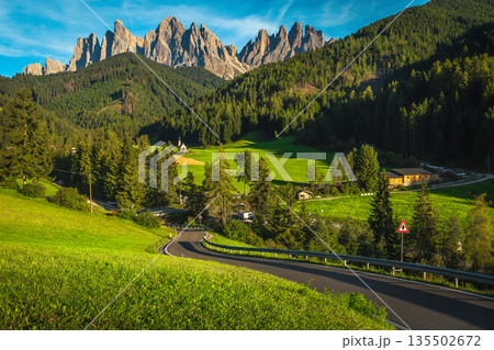 Amazing Funes valley with green fields and spectacular cliffs, Dolomites Amazing Funes valley with green fields and spectacular cliffs, Dolomites 135502672