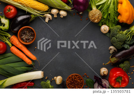 Frame of fresh organic vegetables on wood background. Healthy natural food on rustic wooden table with copy space. Beans and sea satl, carrot, pepper, broccoli and other cooking ingredients top view 135503781