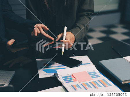 business people in meeting discussing plans together 135505968