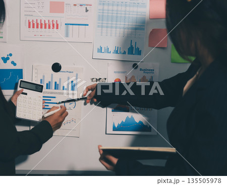 business people in meeting discussing plans together business people in meeting discussing plans together 135505978