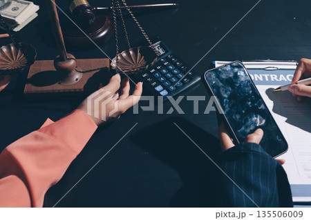 Consultation and conference of professional businesswoman and Male lawyers working and discussion having at law firm in office. Concepts of law, Judge gavel with scales of justice Consultation and conference of professional businesswoman and Male lawyers working and discussion having at law firm in office. Concepts of law, Judge gavel with scales of justice 135506009