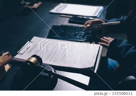 Consultation and conference of professional businesswoman and Male lawyers working and discussion having at law firm in office. Concepts of law, Judge gavel with scales of justice Consultation and conference of professional businesswoman and Male lawyers working and discussion having at law firm in office. Concepts of law, Judge gavel with scales of justice 135506011