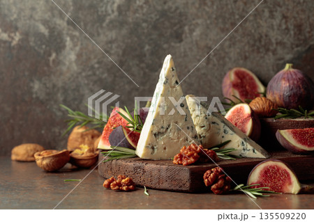 Blue cheese with fresh figs, rosemary, and walnuts. Blue cheese with fresh figs, rosemary, and walnuts. 135509220