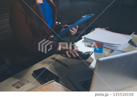 Customer signing a real estate contract in real estate agency. Customer signing a real estate contract in real estate agency. 135510150