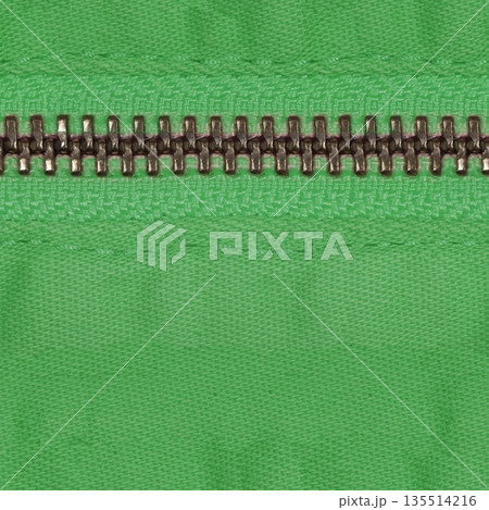 Zipper of green jeans. Close-up of women's jeans, jeans with a zipper. Jeans concept, casual wear concept. Zipper of green jeans. Close-up of women's jeans, jeans with a zipper. Jeans concept, casual wear concept. 135514216