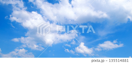 Bright blue sky with fluffy white cumulus clouds Bright blue sky with fluffy white cumulus clouds 135514881