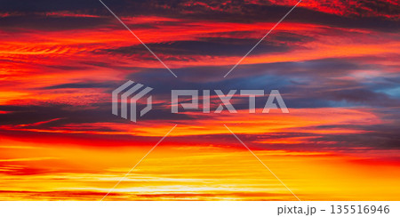 Abstract Saturated Orange-yellow Colors Of Clouds. Unusual Sky Background. Rich Orange Colors. Toned Pink-yellow Clouds. Sky Sunset Sunrise Background. Cloudy Sky. Sunny Cloudscape 135516946