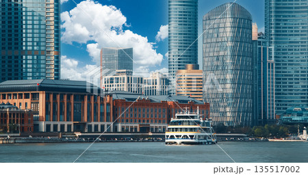 Modern ferry approaching waterfront with historical architectural contrast. Shanghai, China 135517002