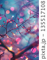 A dreamy, vertical background featuring soft-focus pink, purple, and white bokeh lights intertwined with delicate, dark branches and twigs. Captures a magical, festive, and ethereal mood 135517108