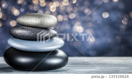 Wellness Balance Concept With Stacked Stones on Wooden Surface in Dim Light Wellness Balance Concept With Stacked Stones on Wooden Surface in Dim Light 135520028