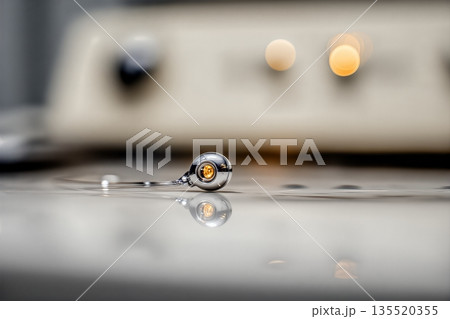 Cybernetic Implant Resting on a Surface Illuminated by Soft Light in a Modern Setting Cybernetic Implant Resting on a Surface Illuminated by Soft Light in a Modern Setting 135520355