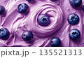 Close-up of creamy light yogurt with whole blueberries, fresh berry in swirls of sweet cream, fruity healthy dairy product, dynamic appetizing scene 135521313