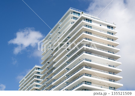 Architecture design of modern building. Perspective residential skyscraper. Modern skyscraper building. Architectural building in Miami beach. Skyscraper perspective view. Hotel architecture Architecture design of modern building. Perspective residential skyscraper. Modern skyscraper building. Architectural building in Miami beach. Skyscraper perspective view. Hotel architecture 135521509