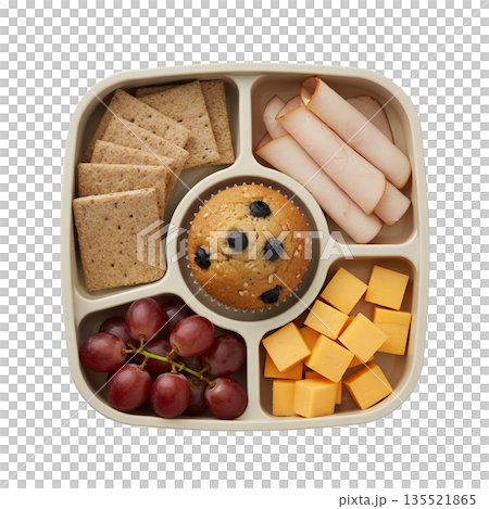 Balanced, healthy lunchbox meal prep with whole grain crackers, sliced meat, cheese, a blueberry muffin, and fresh grapes, isolated 135521865