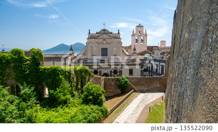Entrance walls of Castel Sant Elmo in Naples, Italy, showing massive stone fortifications and historic military architecture under bright Mediterranean daylight. 135522090