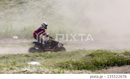 Ukraine Motocross Championship in 2016. Motorcycle racer on the sports ATV during the competition Ukraine Motocross Championship in 2016. Motorcycle racer on the sports ATV during the competition 135522676
