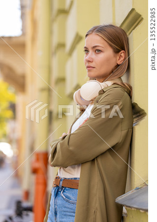 Frustrated Caucasian young woman thinking of money debt budget loss bankruptcy on urban city street Frustrated Caucasian young woman thinking of money debt budget loss bankruptcy on urban city street 135522985