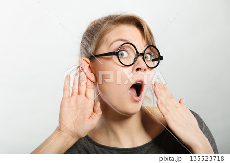 Shocked girl eavesdropping. 135523718
