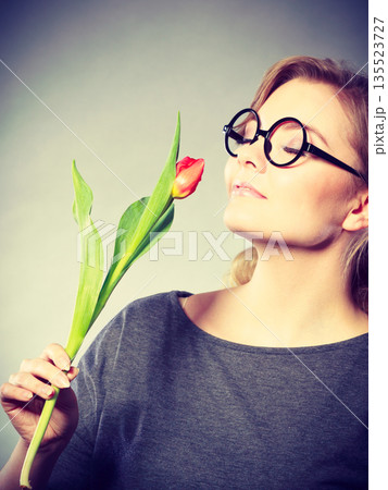 Charming woman smelling flower feel peace. Charming woman smelling flower feel peace. 135523727
