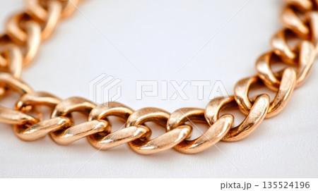 Luxury gold chain necklace macro shot isolated on soft white background 135524196