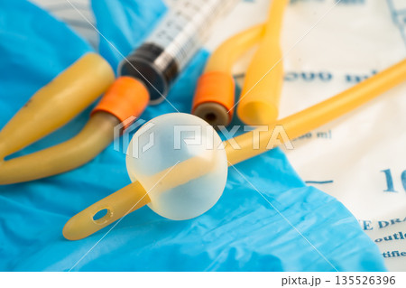Foley urinary catheter with urine bag for disability or patient in hospital. 135526396