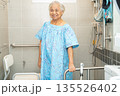 Asian elderly woman patient use toilet bathroom handle security in nursing hospital. 135526402