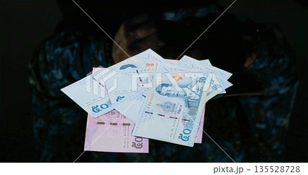 Secret Money Exchange, Unseen Individual Engaged In Secret Banknote Swapping Under Dim Illumination Secret Money Exchange, Unseen Individual Engaged In Secret Banknote Swapping Under Dim Illumination 135528728