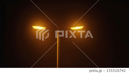 Luminous Foggy Street, Mysterious Scene With Glowing Lamp Amid Silent Foggy City Streets At Night 135528742