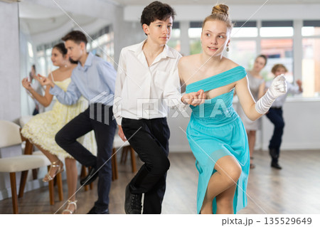 Boy and girl dancing twist in studio 135529649