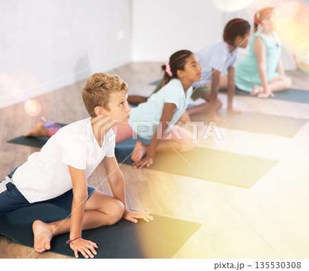 Kids yoga one legged king pigeon pose or eka rada rajakapotasana. Kids yoga one legged king pigeon pose or eka rada rajakapotasana. 135530308