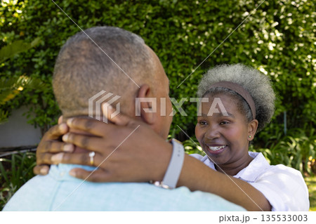Senior couple embracing outdoors, smiling and enjoying joyful moment together Senior couple embracing outdoors, smiling and enjoying joyful moment together 135533003