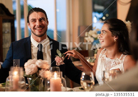 Bride and groom laughing together at elegant wedding reception dinner Bride and groom laughing together at elegant wedding reception dinner 135535531