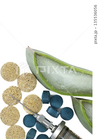 Aloe vera slice with pills and syringe, representing natural medicine and alternative treatments Aloe vera slice with pills and syringe, representing natural medicine and alternative treatments 135536056