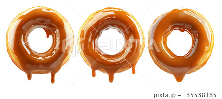 Tasty round donut topped with caramel and vanilla glaze swirl, isolated on white transparent background Tasty round donut topped with caramel and vanilla glaze swirl, isolated on white transparent background 135538185