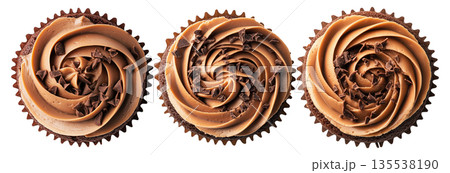 Chocolate cupcake topped with creamy swirled frosting and chocolate shavings, isolated on white background 135538190