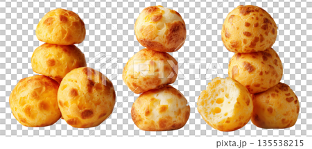 Stack of Brazilian cheesy bread balls with golden crust and holes, isolated on white background, concept of Pao de Queijo food 135538215