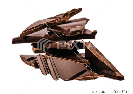 Stack of broken dark chocolate pieces isolated on white background Stack of broken dark chocolate pieces isolated on white background 135539750