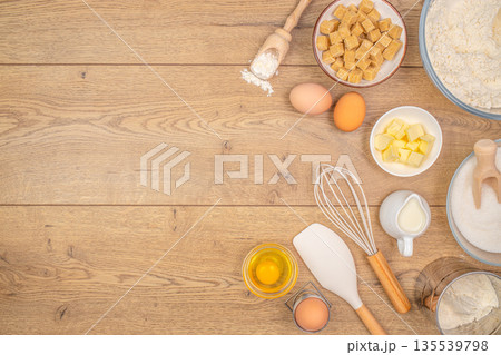 Baking ingredients with eggs butter sugar and flour arranged on wooden table with copy space Baking ingredients with eggs butter sugar and flour arranged on wooden table with copy space 135539798