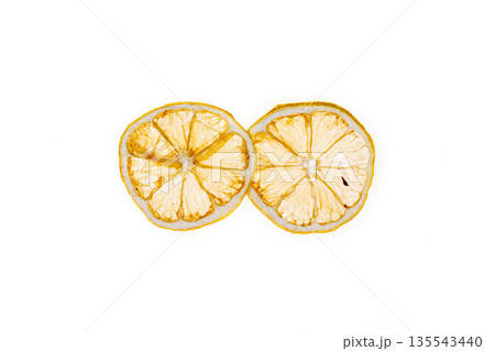 Sun-dried (dried) lemon close up on a white background 135543440