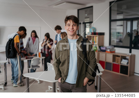 Confident teen student in classroom in school. Confident teen student in classroom in school. 135544085