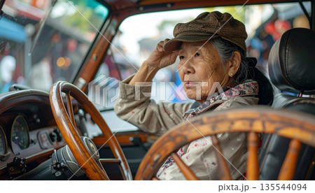 Senior Thai Woman Driver in Vintage Samlor Tricycle Taxi 135544094