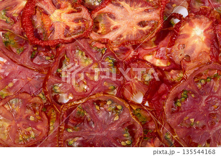 Sun-dried (dried) tomatoes closeup 135544168