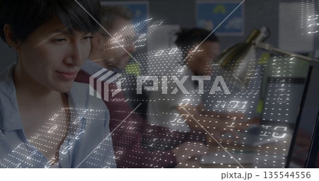 Concentrating Asian woman typing code at desk in tech office, with code overlay, copy space Concentrating Asian woman typing code at desk in tech office, with code overlay, copy space 135544556
