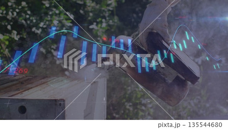 Fanning metal bee smoker by gloved beekeeper over wooden hive box at apiary, with chart overlay 135544680