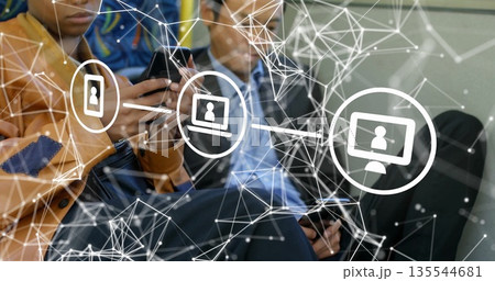 Tapping smartphones, woman in leather jacket, man in jacket sitting on bus showing network overlay 135544681