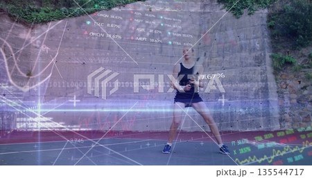 Standing athlete wearing tank top and shorts in sneakers on painted court, with ivy, data graphics 135544717