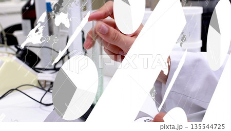 Technician in white lab coat holding glass cylinder at lab bench, with power cords, digital overlay Technician in white lab coat holding glass cylinder at lab bench, with power cords, digital overlay 135544725